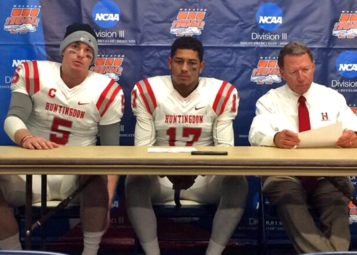 Senior quarterback Luke Bailey (left), junior defensive back Demetrius Brown (center) and head coach Mike Turk (right) meet with the media after Saturday's first-round loss at 12th-ranked Wheaton College. (Photo by Hal Davis)