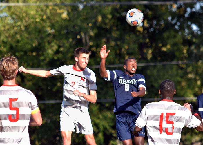 Zach den Besten heads the ball away in Wednesday's loss to Berry.