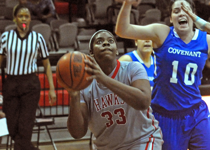 Tan Munford, shown here against Covenant, pulled down 11 rebounds in Saturday's 73-50 loss to Maryville. With her seventh rebound, she became the Lady Hawks' career rebounding leader. (Photo by Wesley Lyle)