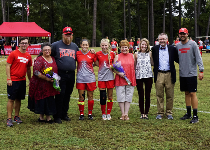 Seniors Kira Bohlke (#5) and Clara Tapplin (#26) were honored before Saturday's game against Salem. (Photo by Chuck Tidmore)